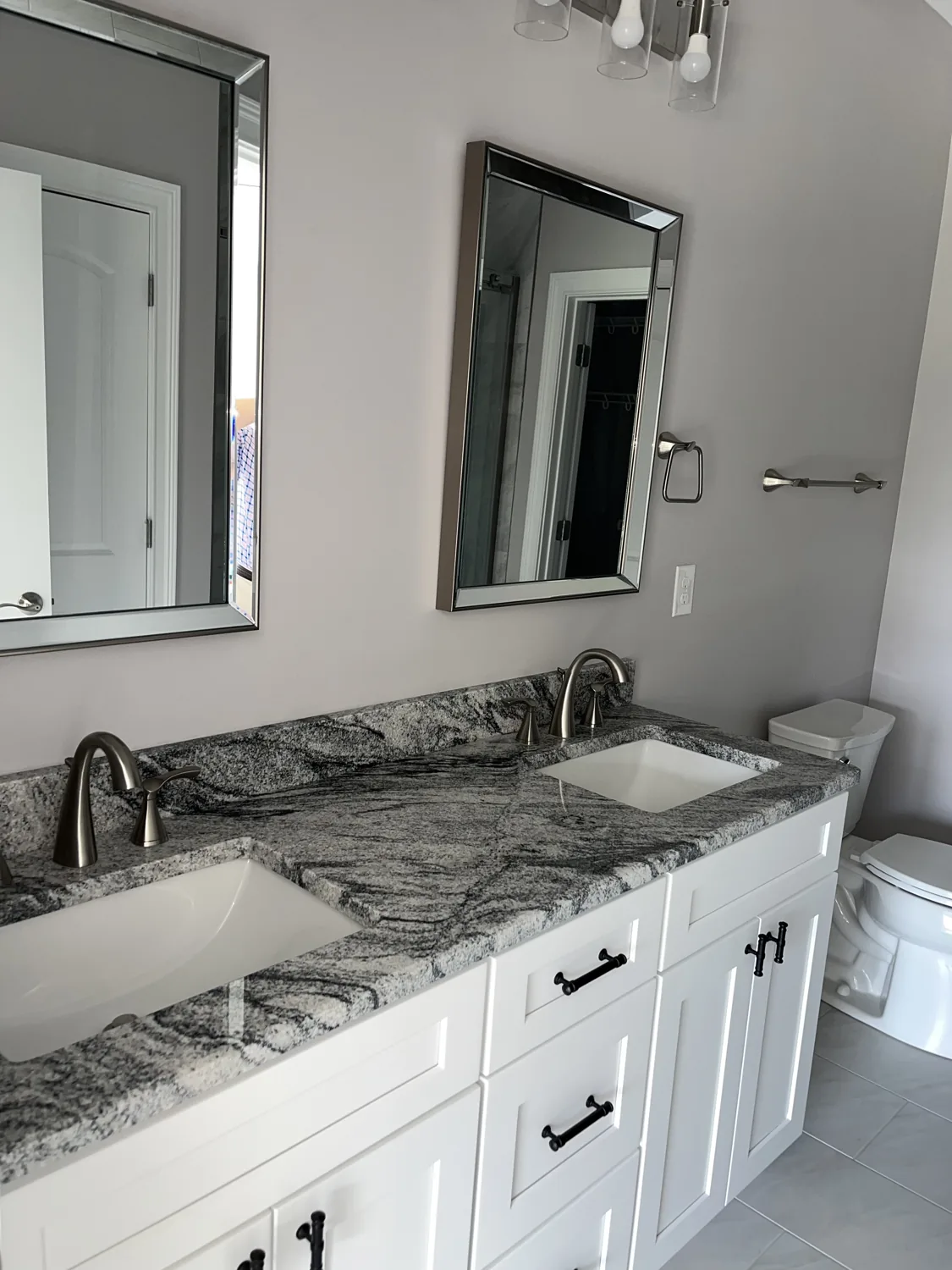 Double-sink bathroom vanity with granite countertop at Old Silo Hill #2